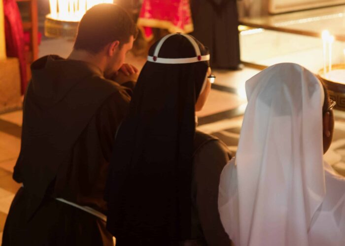 praying at the holy land pilgrimage tour