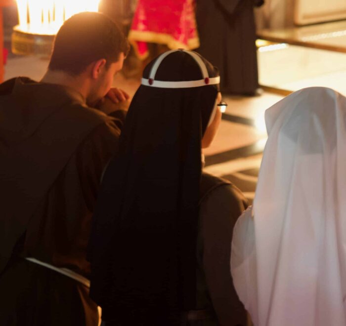 praying at the holy land pilgrimage tour