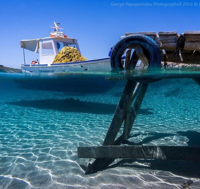 boat at patmos greece clear water pilgrimage tour