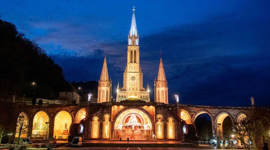 lourdes basilica at night pilgrimage tour