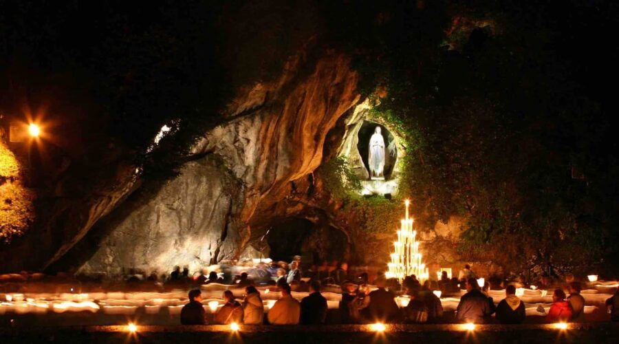 lourdes grotto at night pilgrimage tour