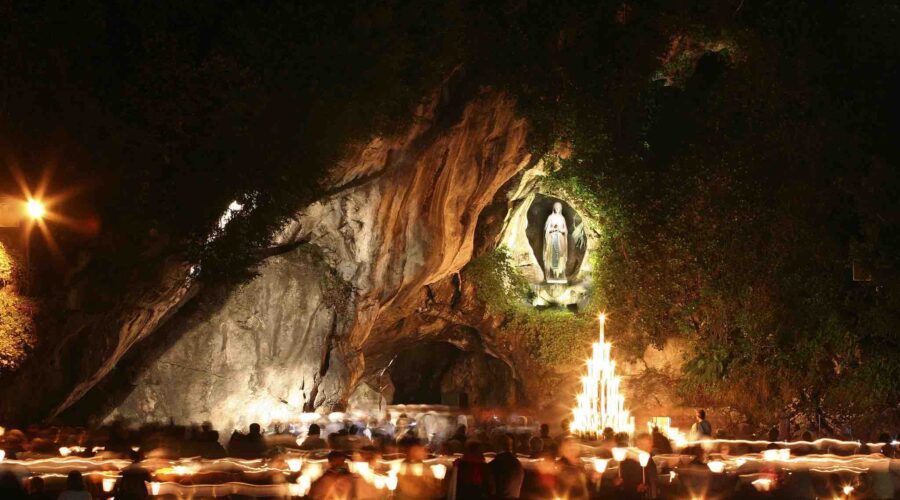 lourdes grotto at night again pilgrimage tour
