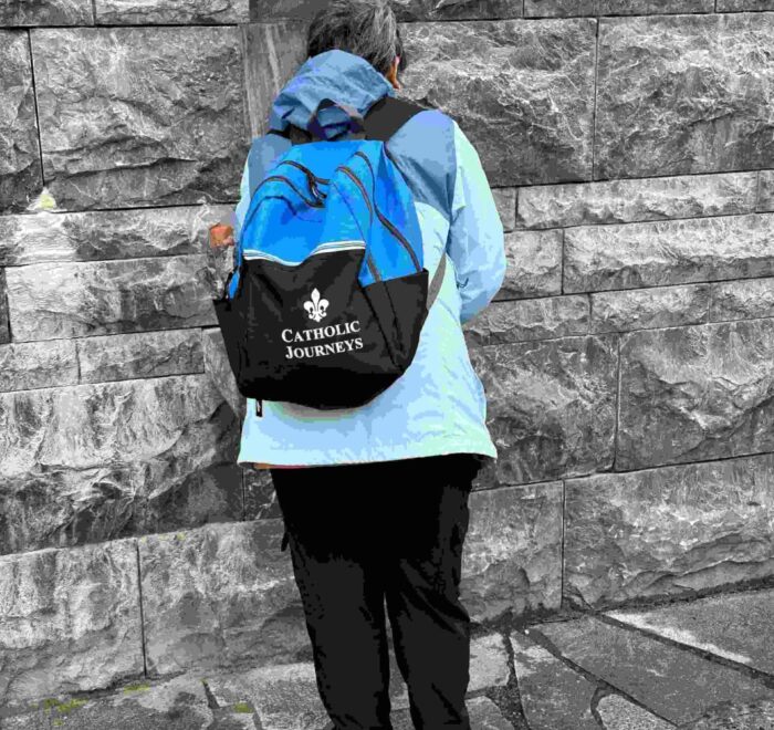 lourdes holy water person pilgrimage tour