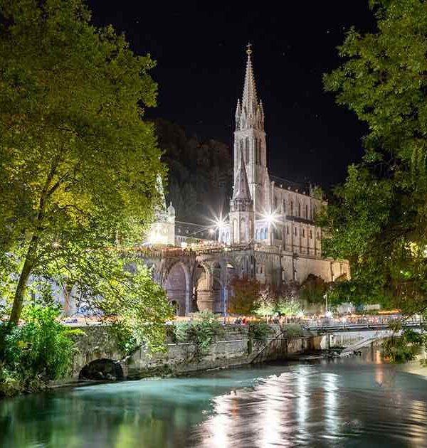 lourdes river at night pilgrimage tour france