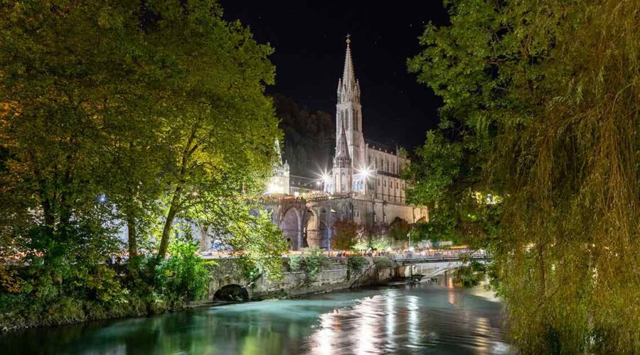 lourdes river at night pilgrimage tour france