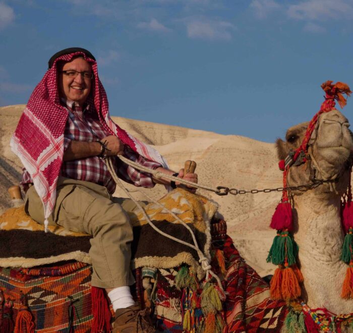 father restrepo with camel pilgrimage tour holy land